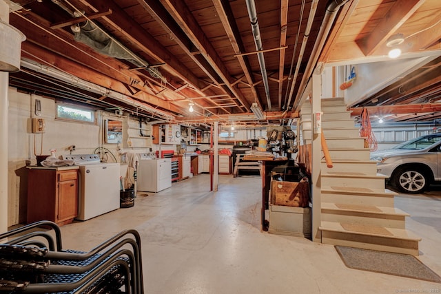 basement with washing machine and clothes dryer