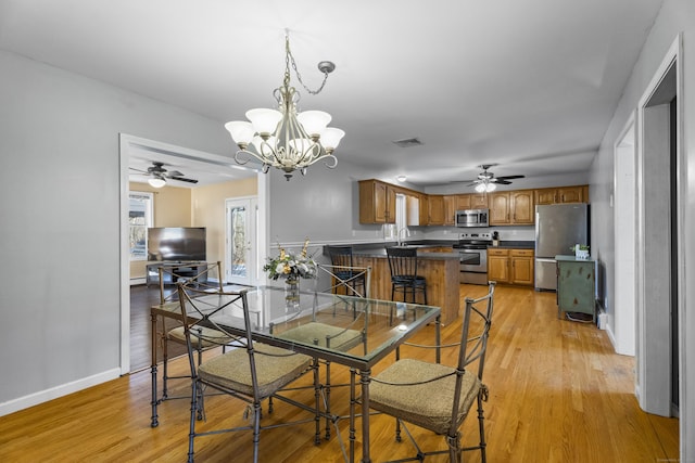 5 Ridge Ln, Shelton, CT 06484 - dining area featuring visible vents, light wood finished floors, and ceiling fan with notable chandelier