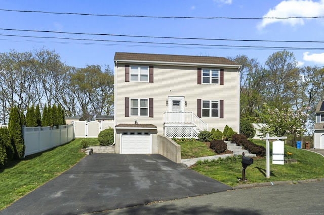 5 Ridge Ln, Shelton, CT 06484 - view of front of property featuring an attached garage, a front lawn, fence, and driveway
