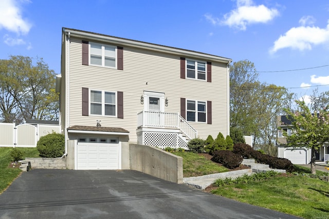 5 Ridge Ln, Shelton, CT 06484 - view of front of property featuring driveway, a front yard, a gate, a garage, and fence