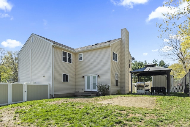 5 Ridge Ln, Shelton, CT 06484 - back of property featuring a lawn, fence, french doors, a chimney, and a gazebo