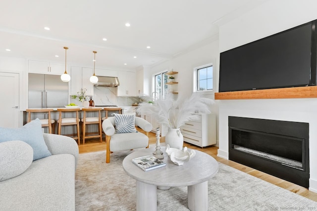 345 Reef Rd Unit B6, Fairfield, CT 06824 - living room featuring light wood finished floors, recessed lighting, a fireplace, and ornamental molding