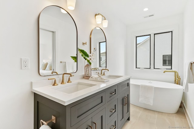 345 Reef Rd Unit B6, Fairfield, CT 06824 - full bathroom with double vanity, a freestanding bath, and recessed lighting