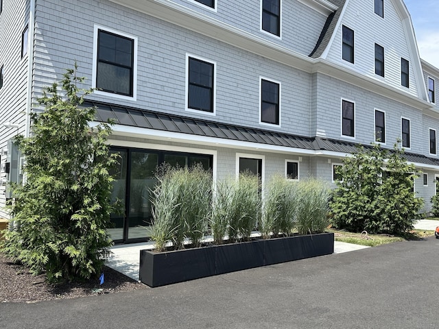 345 Reef Rd Unit B6, Fairfield, CT 06824 - view of property exterior featuring a standing seam roof and a metal roof