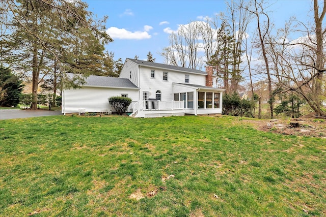 70 Cali Dr, Shelton, CT 06484 - rear view of property with a lawn, a chimney, a sunroom, and a wooden deck
