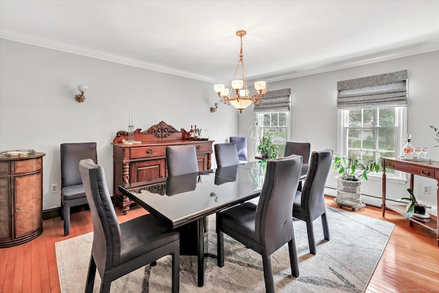 70 Cali Dr, Shelton, CT 06484 - dining area with hardwood / wood-style flooring, a baseboard heating unit, ornamental molding, and a chandelier
