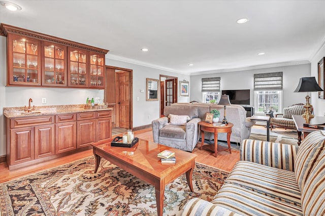 70 Cali Dr, Shelton, CT 06484 - living area with wet bar, recessed lighting, crown molding, and light wood-style flooring