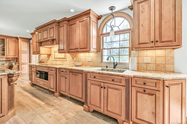 70 Cali Dr, Shelton, CT 06484 - kitchen with recessed lighting, light wood-style floors, a sink, and black electric cooktop