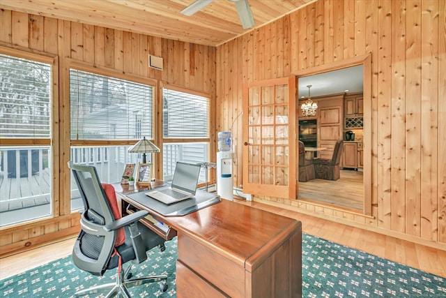 70 Cali Dr, Shelton, CT 06484 - office area with ceiling fan with notable chandelier, plenty of natural light, wooden walls, and wood-type flooring