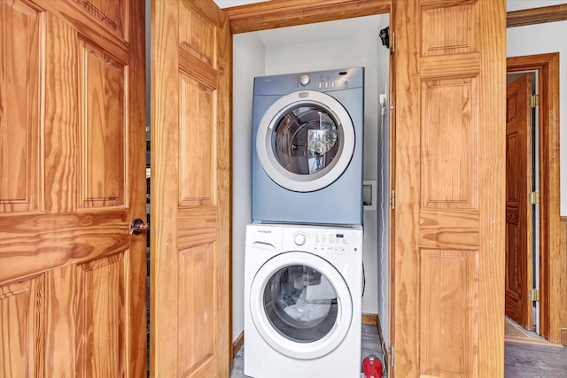 70 Cali Dr, Shelton, CT 06484 - laundry room with wood finished floors, stacked washer and clothes dryer, and laundry area