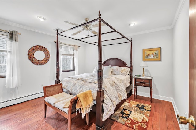 70 Cali Dr, Shelton, CT 06484 - bedroom featuring hardwood / wood-style floors, a ceiling fan, crown molding, baseboards, and baseboard heating