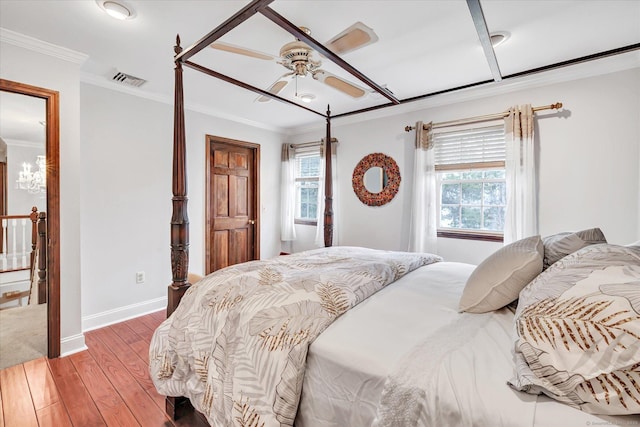 70 Cali Dr, Shelton, CT 06484 - bedroom with hardwood / wood-style floors, visible vents, crown molding, and baseboards