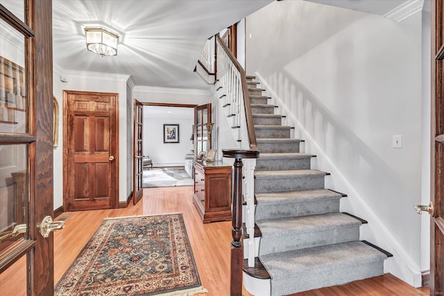 70 Cali Dr, Shelton, CT 06484 - foyer entrance with stairway, ornamental molding, french doors, light wood-type flooring, and baseboards