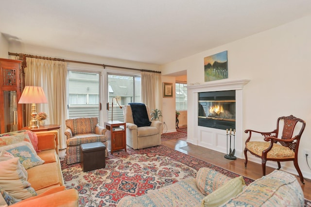 37 Wilton Crst, Wilton, CT 06897 - living area featuring wood finished floors, a glass covered fireplace, and baseboards