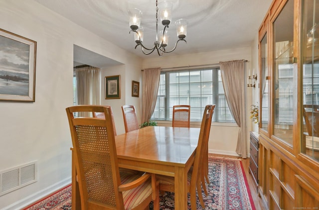 37 Wilton Crst, Wilton, CT 06897 - dining space featuring a chandelier, baseboards, and wood finished floors