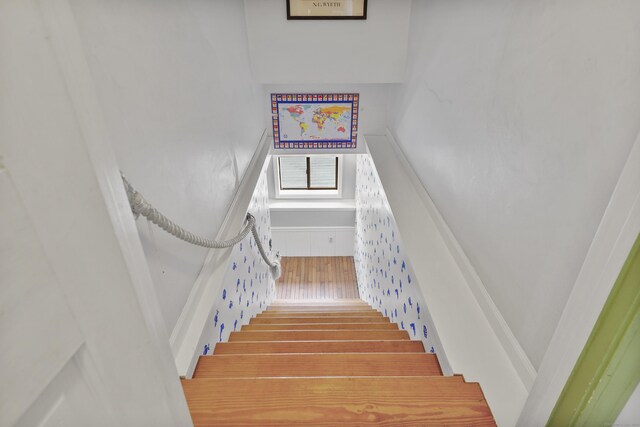 stairs with wood finished floors