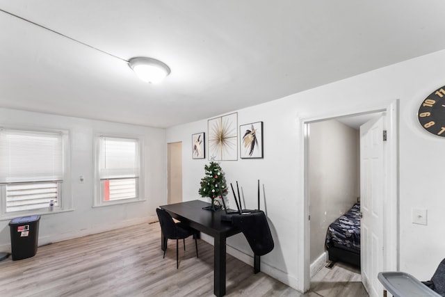 office with baseboards and wood finished floors