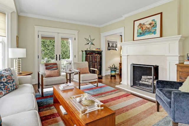 living room featuring crown molding, a fireplace with raised hearth, french doors, baseboards, and dark wood-style floors