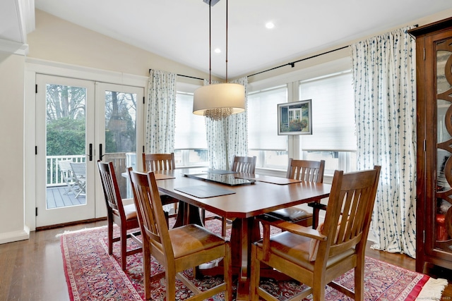 dining area featuring recessed lighting, vaulted ceiling, wood finished floors, french doors, and baseboards