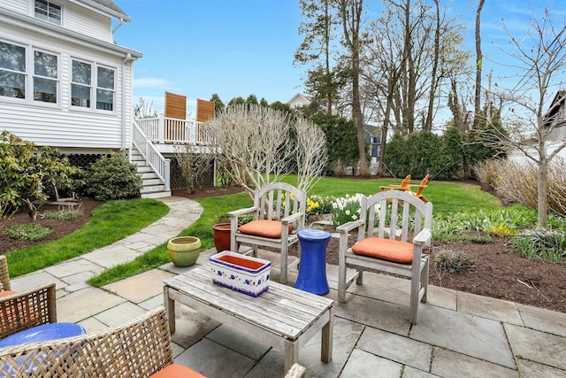 view of patio / terrace with stairway and a wooden deck