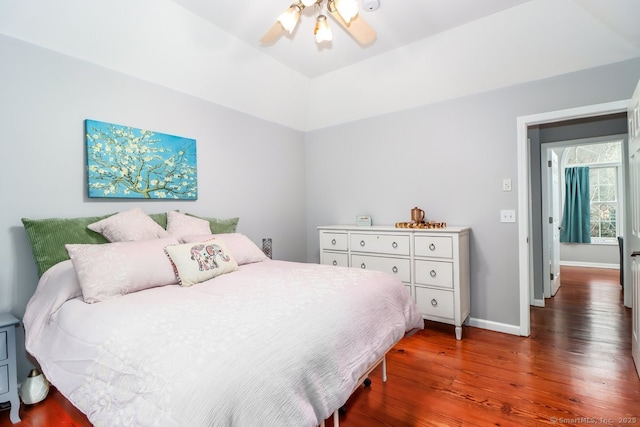 bedroom with baseboards, a ceiling fan, and wood finished floors