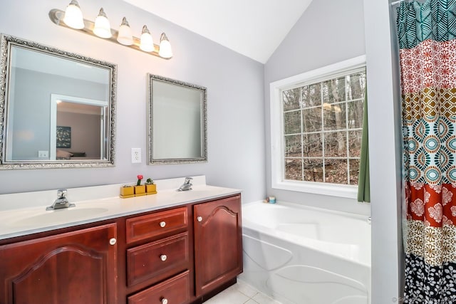 full bath featuring double vanity, a bath, a sink, and lofted ceiling