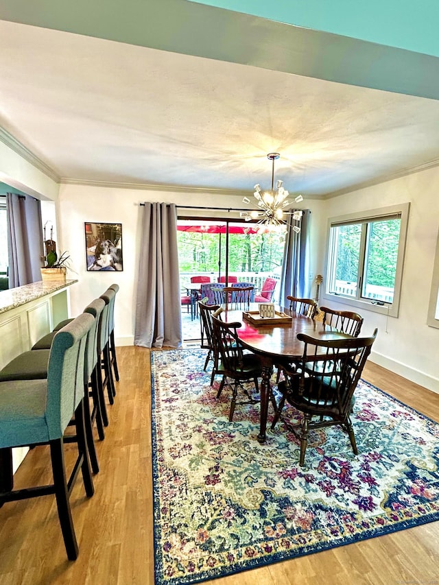 18 Paul St, Danbury, CT 06810 - dining space with a chandelier, wood finished floors, ornamental molding, and baseboards