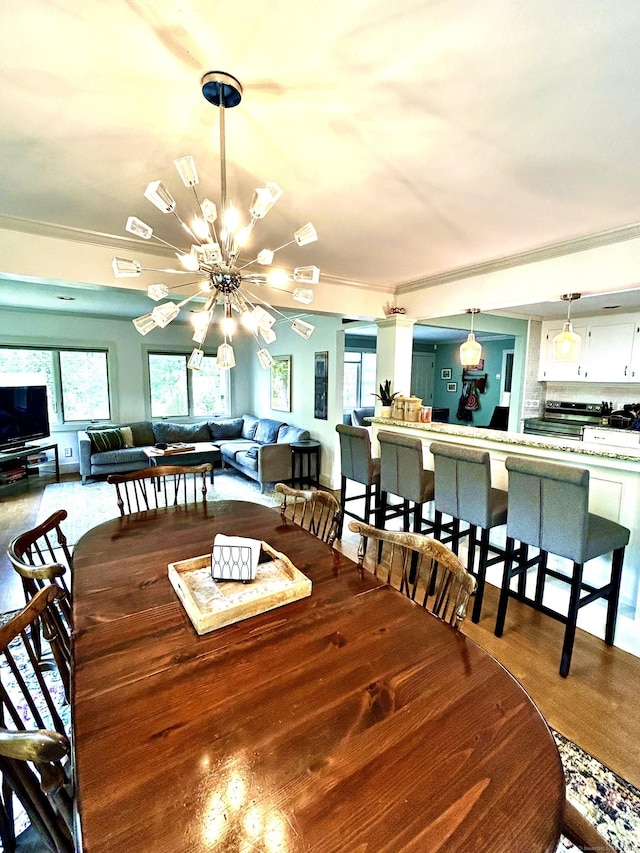 18 Paul St, Danbury, CT 06810 - dining space featuring a chandelier, ornamental molding, and wood finished floors
