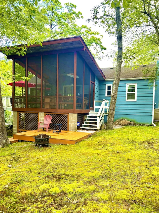 18 Paul St, Danbury, CT 06810 - back of property with a fire pit, a sunroom, and a lawn
