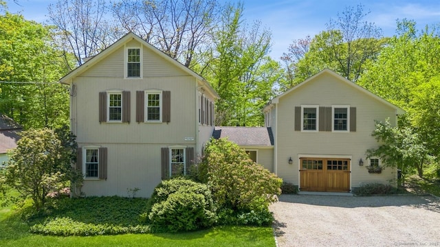 traditional-style house featuring driveway and a garage