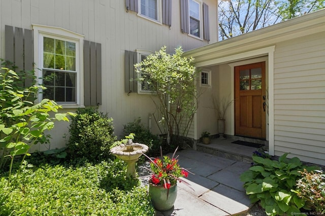property entrance featuring a patio