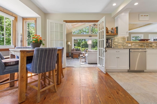 dining space featuring lofted ceiling and recessed lighting