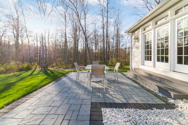 view of patio / terrace with outdoor dining space and entry steps