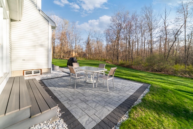 deck featuring a yard, a patio area, and outdoor dining area
