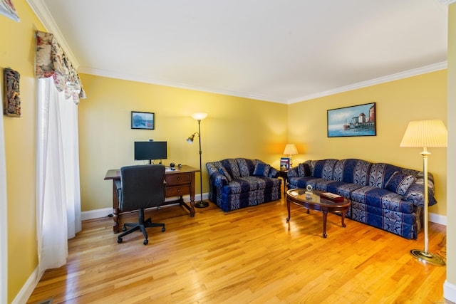 living area featuring light wood-type flooring, baseboards, and ornamental molding