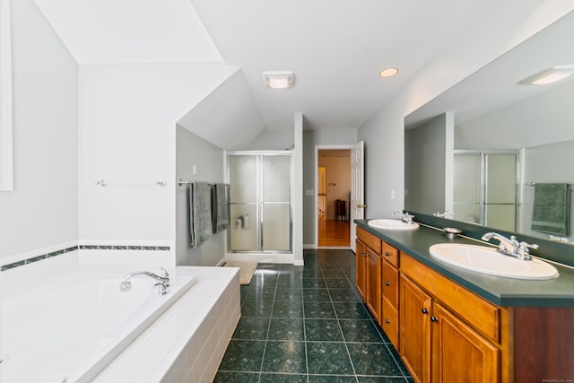 full bath with tile patterned flooring, double vanity, a sink, a garden tub, and a stall shower