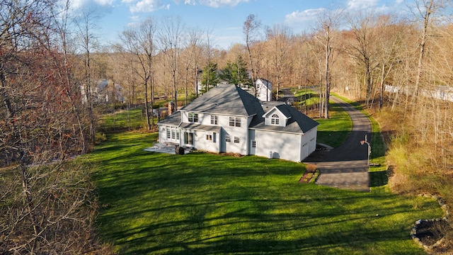 view of home's exterior with a yard