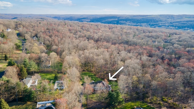 aerial view featuring a view of trees