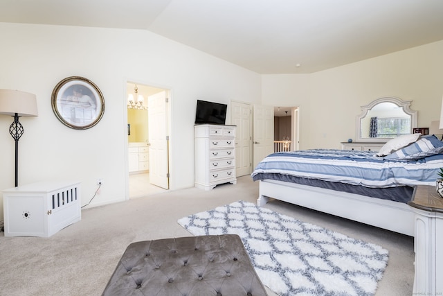 bedroom featuring lofted ceiling, ensuite bath, baseboards, a chandelier, and light colored carpet