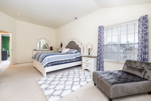 bedroom featuring baseboards, lofted ceiling, visible vents, and light colored carpet