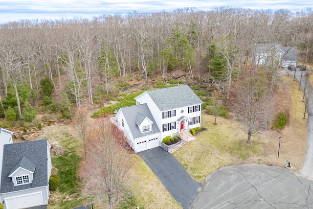 drone / aerial view with a view of trees