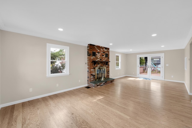 63 Rita Dr, Bristol, CT 06010 - unfurnished living room featuring healthy amount of natural light, light wood-type flooring, baseboards, crown molding, and recessed lighting