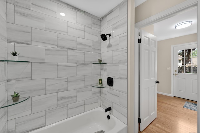 63 Rita Dr, Bristol, CT 06010 - bathroom featuring shower / bath combination, wood finished floors, and baseboards