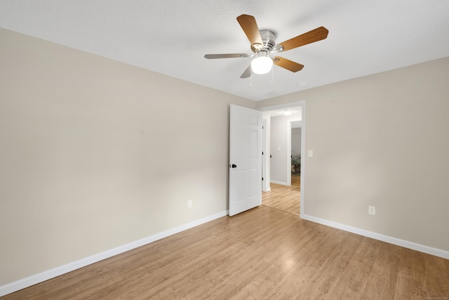 63 Rita Dr, Bristol, CT 06010 - unfurnished room featuring baseboards, light wood-style floors, and ceiling fan