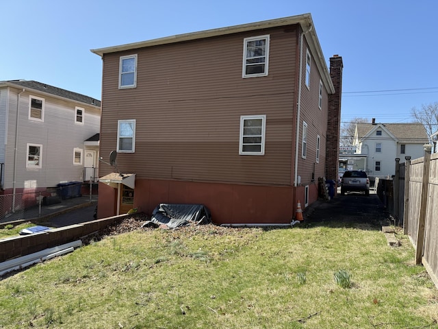 186 York St, West Haven, CT 06516 - back of house featuring fence and a lawn