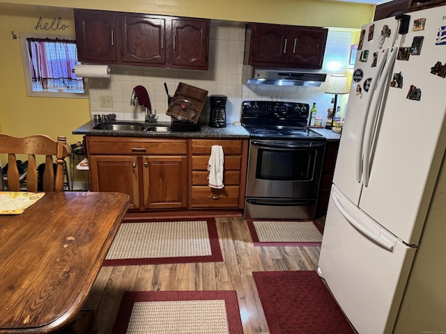 186 York St, West Haven, CT 06516 - kitchen with a sink, freestanding refrigerator, electric stove, under cabinet range hood, and light wood-style flooring