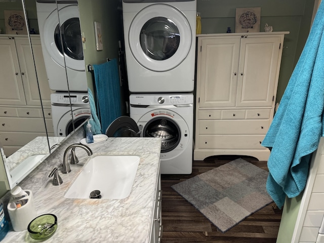186 York St, West Haven, CT 06516 - washroom featuring laundry area, dark wood-style floors, a sink, and stacked washer and clothes dryer
