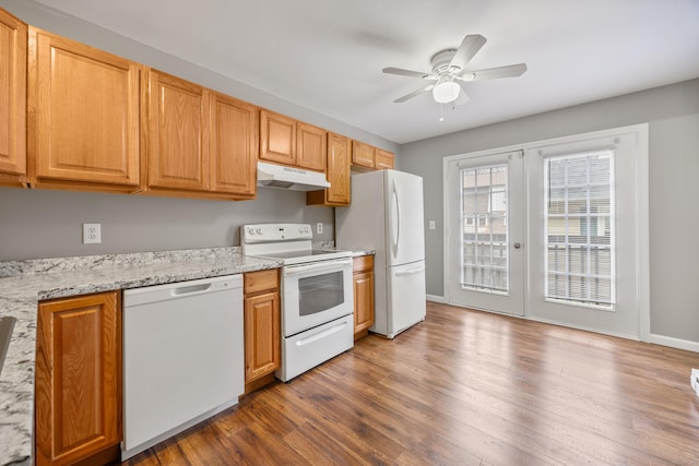 kitchen with wood finished floors, white appliances, ceiling fan, french doors, and under cabinet range hood