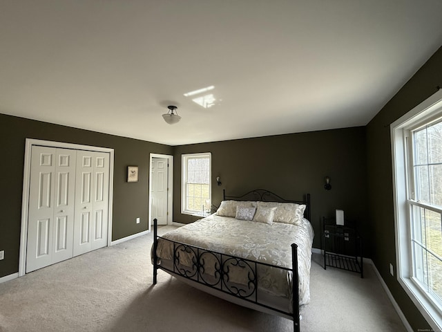 2 Anita Way, Warren, CT 06754 - carpeted bedroom featuring multiple closets, multiple windows, and baseboards