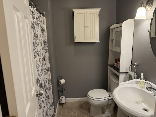 2 Anita Way, Warren, CT 06754 - bathroom with a sink, toilet, baseboards, and curtained shower